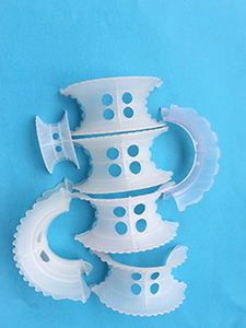 Plastic Heteroclitic Saddle Ring Packing